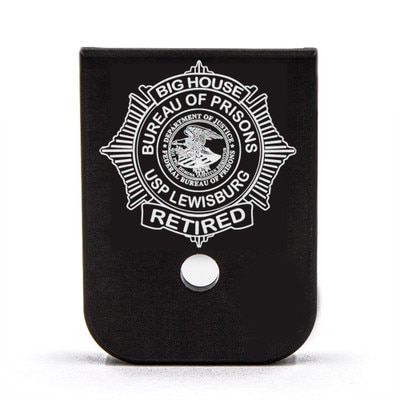 Bureau of Prisons badge design engraved on a magazine base plate
